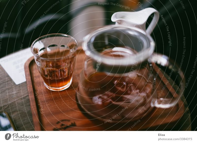A coffee pot with a glass of coffee on a wooden tray in a café Coffee Wood Retro Coffee break Aromatic Morning Beverage Caffeine Vintage Brown atmospheric Café
