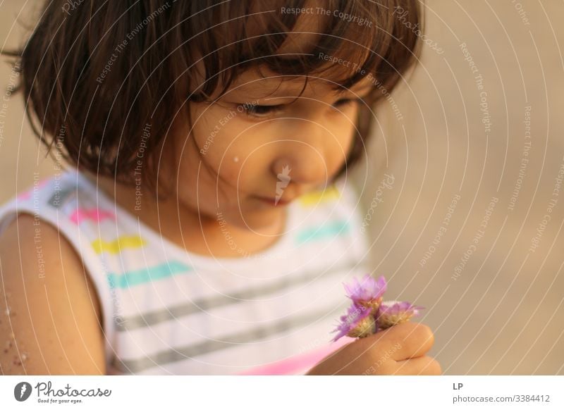 Beautiful little girl holding flowers Give human being Hope childhood Family & Relations