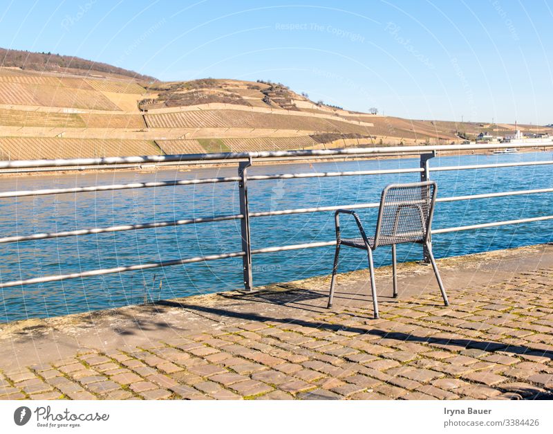 Lonely chair near with river in the sun day. bachground summer spring sunny outdoor sea swimming terrace view relax nature peace hotel beautiful sky water
