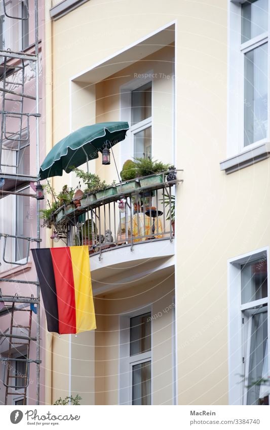 fly the flag Flag Balcony Germany Facade nobody Colour photo patriotic black Red Gold Sunshade Exterior shot German Flag Ensign Patriotism Day Pride