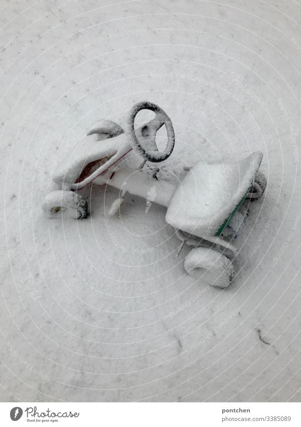 Snowy pedal car Infancy snowy White Winter chill snowed in Deserted Day Colour photo Exterior shot Nature Weather Mobility