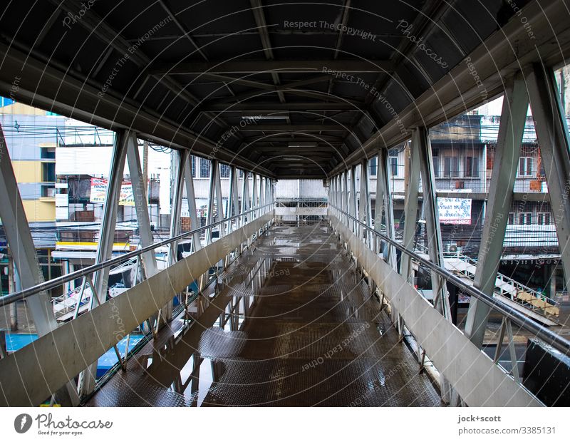 Pedestrian bridge in Bangkok rainy day Reflection Structures and shapes Pedestrian crossing Bridge Urban canyon Facade Puddles Direct Architecture