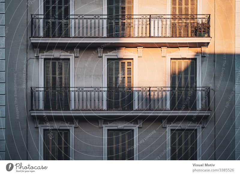 Sunset lights illuminating some balconies of a building color architecture architectural architectonic outdoor outdoors exterior urban city natural light