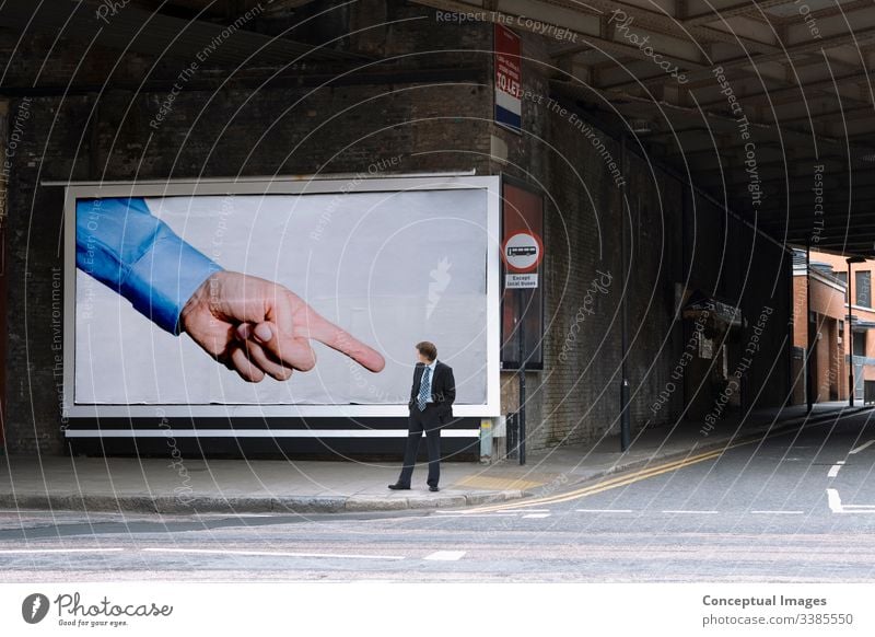 Billboard pointing at businessman it could be you billboard finger humour admire adult architecture building caucasian city city life color commuter