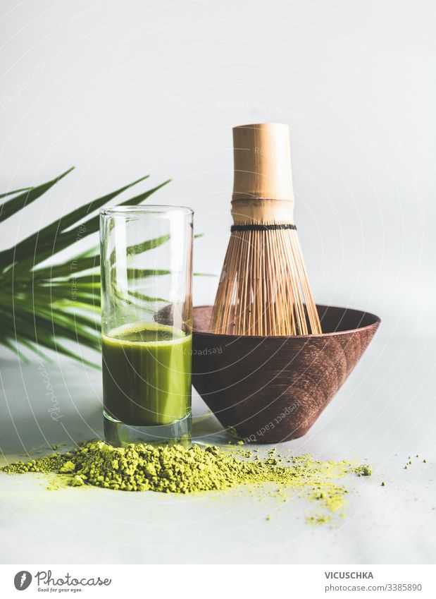 Matcha tea powder with glass of matcha espresso and matcha whisk set. Healthy lifestyle concept matcha tea healthy antioxidant japan aromatic zen herbal