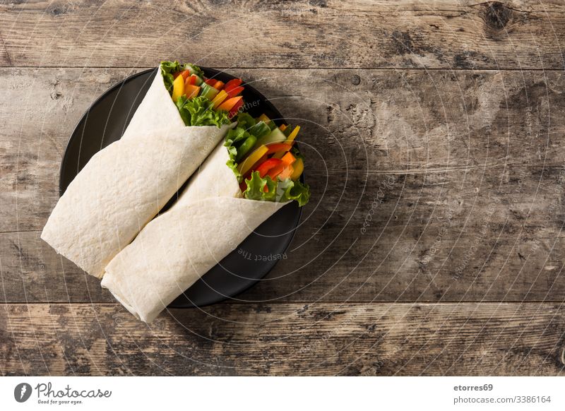 Download Vegetable Tortilla Wraps On Yellow Background Top View Copy Space A Royalty Free Stock Photo From Photocase Yellowimages Mockups