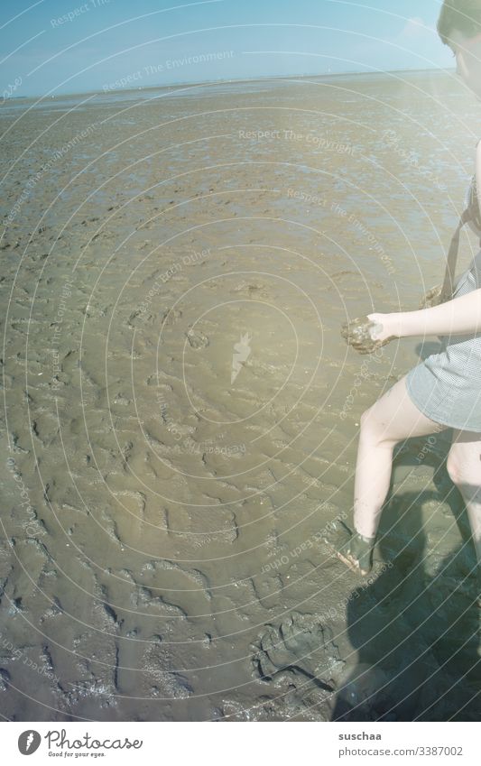 teenagers in the wadden sea Girl Young woman Partially visible Mud slush Mud flats Slick North Sea Ocean Low tide High tide mudflat hiking tour Dirty dirt