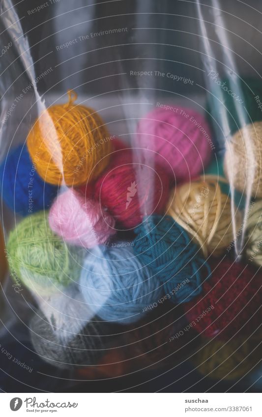 ball of wool in a plastic bag Wool Ball of wool Leisure and hobbies Soft Handcrafts Knit Calm Warmth Wooly Detail coiled variegated Plastic bag safekeeping