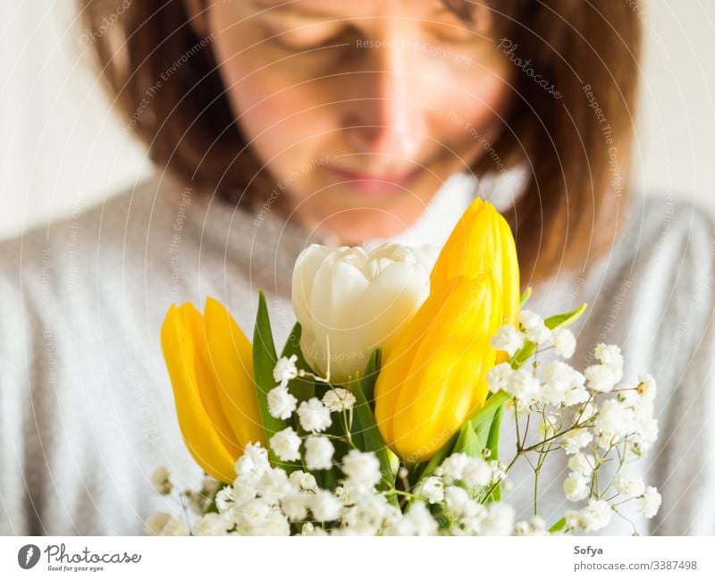 Woman holding bouquet of yellow and white tulips. Women's, mother's day concept. flower bunch woman give spring easter hands floral lady march gift invitation