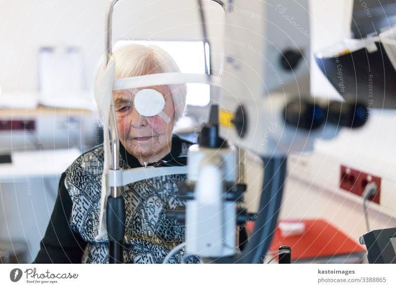 Senior woman wearing eye pathc after laser surgery procedure at ophthalmology clinic. sight senior optical vision female person beam eyepatch pensioner eld face