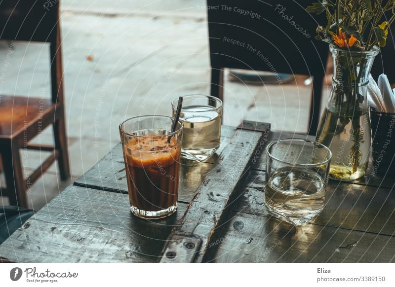 Vietnamese iced coffee on a wooden table in an outdoor café in retro colour Coffee Retro Coffee break Aromatic Morning Beverage Caffeine Vintage Brown