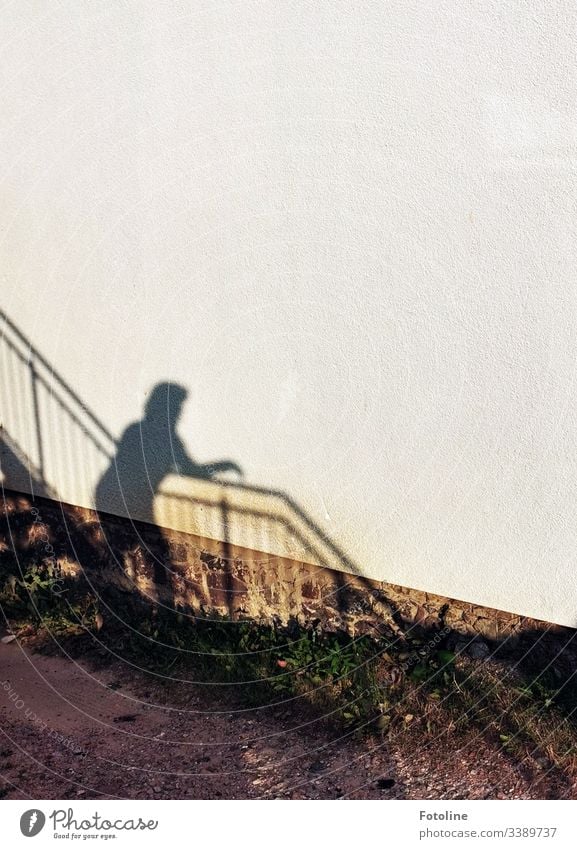 Shadow of a woman on a staircase with banister on a house wall Light and shadow Architecture Building Wall (building) Wall (barrier) Exterior shot Day