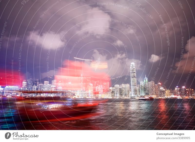 Cityscape Hong Kong And Junkboat At Twilight Stock Photo