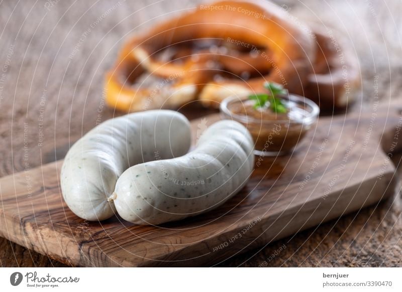 Pair of Bavarian veal sausages White sausages Veal sausage Breakfast plank Wood Portion Couple two Oktoberfest European Eating Hot Rustic Mustard Pretzel