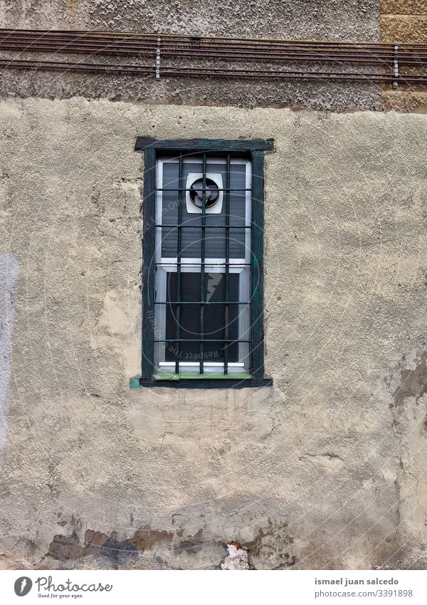 old window on the wall of the house in Bilbao city Spain facade building exterior balcony home street outdoors color colorful structure architecture
