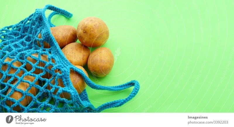 Cotton shopping net - Free of plastic. Reusable shopping bag with potatoes on a green background. Zero waste and ecology concept. environmentally friendly buyer. top view