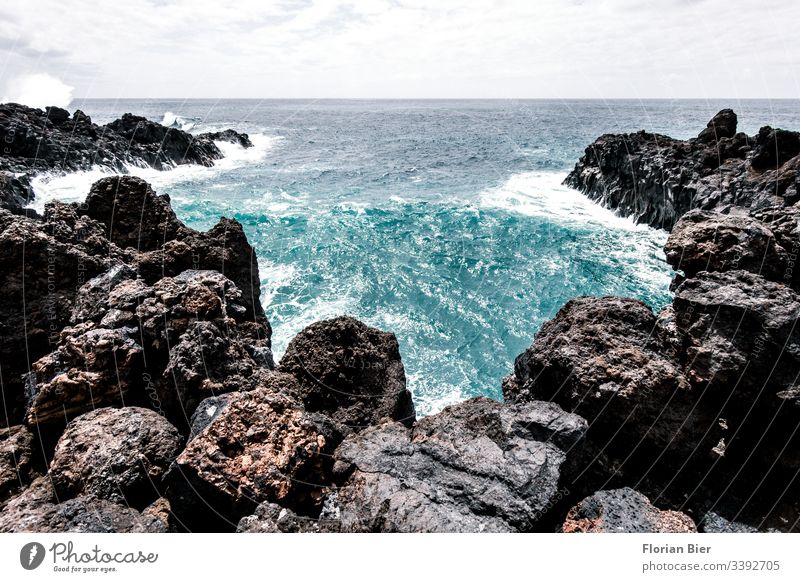 Rocky bay with strong swell Bay Water Waves Massive Ocean Stone rocky harsh Deep Coast Landscape Cliff Nature Vantage point Freedom Picturesque