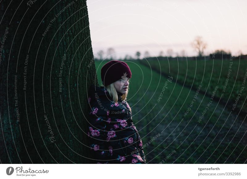 Sad child Child Girl Tree Exterior shot Infancy Human being sad sad girl Meditative Winter Cap people Expression Earnest Concern Emotions