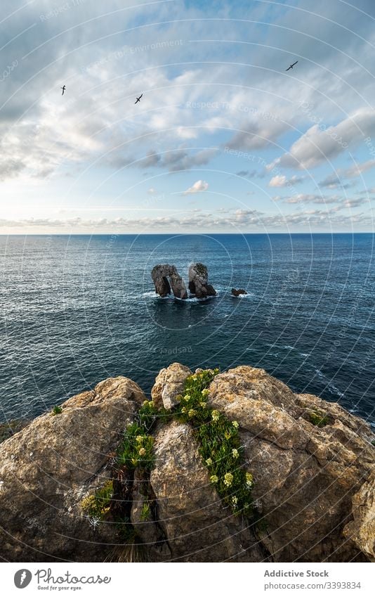 Peaceful landscape of rocky cove in sunset scenery peaceful sea skyline coastline nature water destination tourism seascape cliff stone holiday summer vacation