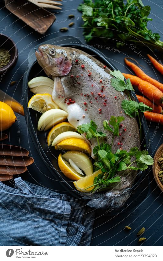 Raw fish with lemon and herbs dinner kitchen fresh seasoning parsley onion raw cook dish food preparation home carrot meal ingredient culinary cuisine organic