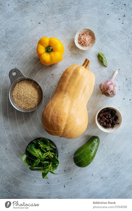 Ingredients for vegan recipe with butternut squash ingredient vegetarian food cooking pumpkin vegetable healthy grain avocado pepper garlic leaves spices