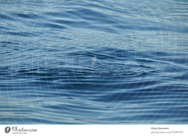 Just the blue ocean with little waves sea water deep nature background texture roundwaves circle