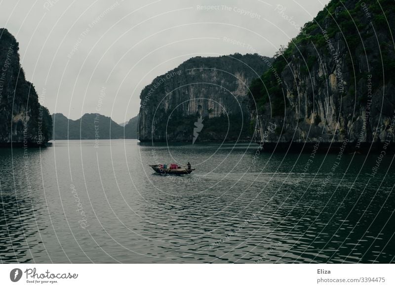 Floating fishing village on the water with fish farm and nets in Halong Bay  in Vietnam - a Royalty Free Stock Photo from Photocase