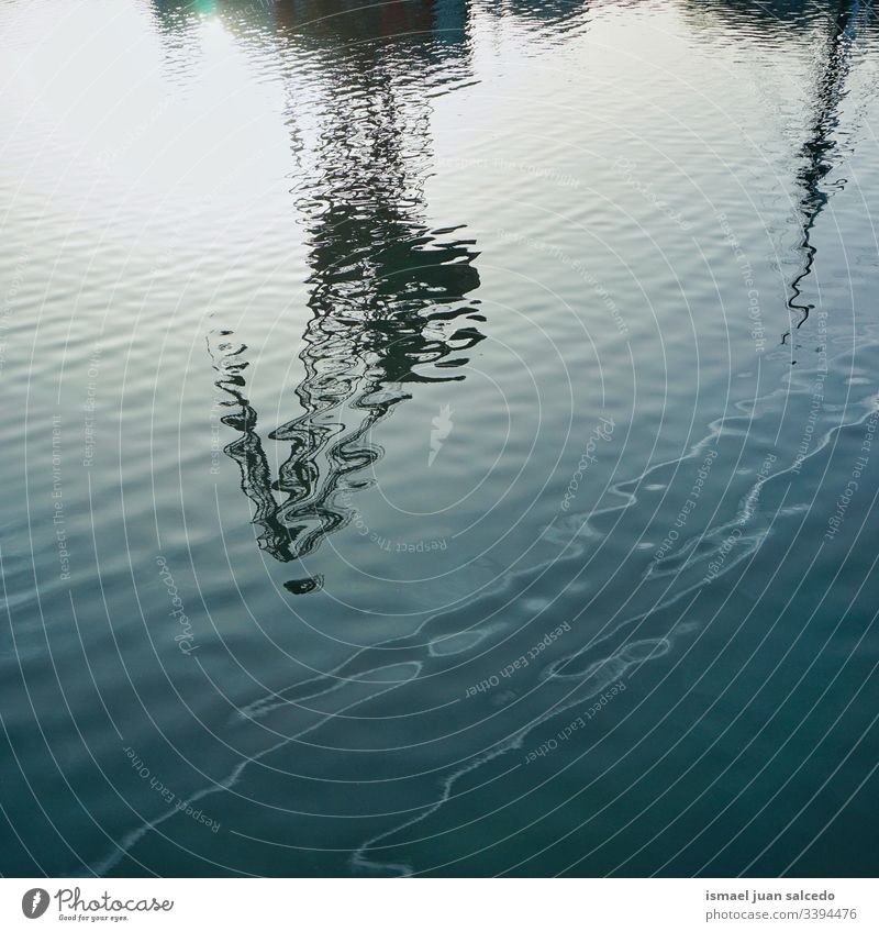 Light Blue swimming pool rippled water texture reflection. Beautiful blue  water background with glare from the sun. Stock Photo