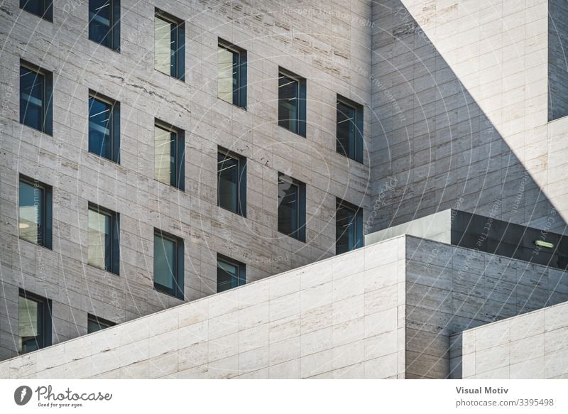 Architectural geometry view of a business building built in roman travertine marble abstract abstract background abstract photography afternoon architectonic