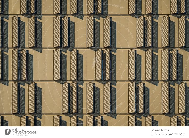 Modern building facade full of window shutters urban facade Architecture structure windows no people eclectic abstract background building design metropolitan