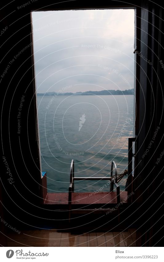 View from the door of a ship to a bathing ladder and the sea swimming ladder Window Looking Ocean Water bathe Ladder Vantage point Freedom Swimming & Bathing