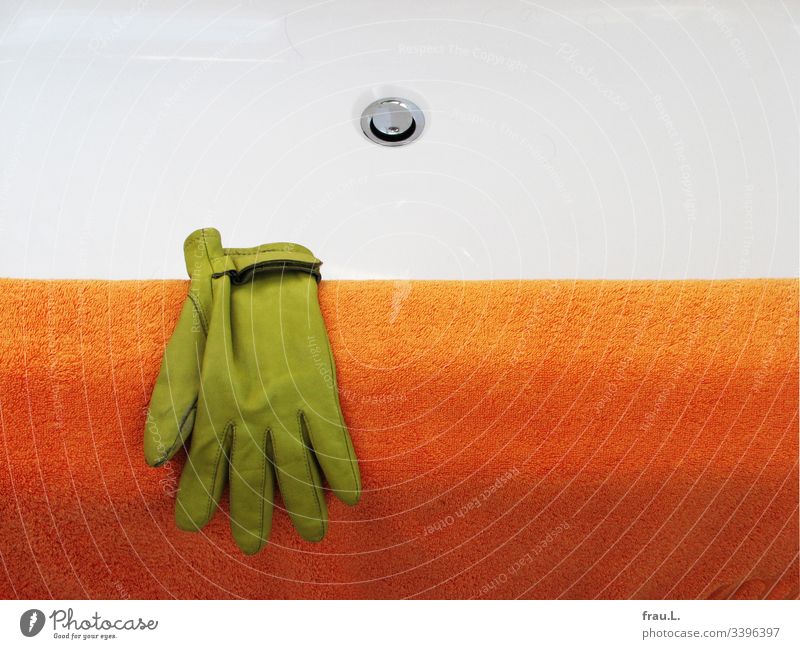 He didn't remember how the green glove had got on the edge of the bathtub, but he felt quite comfortable on the cuddly bath towel now. Orange Bathtub Dry Clean