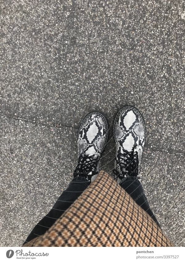 View from above of lower body with snakeskin shoes Snakeskin Boots Pattern manrepeller Checkered diamonds Coat shoelaces Fashion trend Hipster Asphalt Street