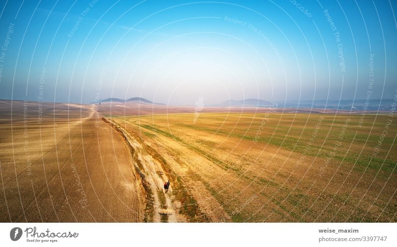 Aerial view of a ploughed agricultural field. Field path through farmland panorama Agriculture Street sunny Natural Farm Rural Antenna Environment attachable