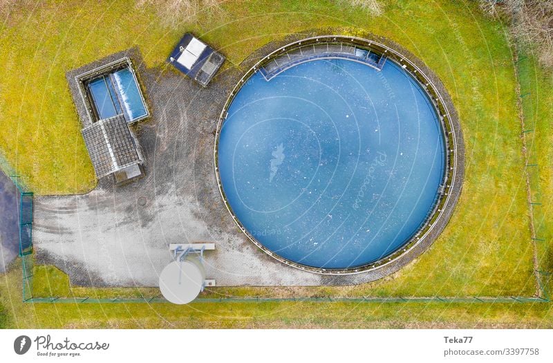 a small wastewater treatment plant in winter from above bad good dirty clean drinking water toilet water cleaning urin feces rubish water plant