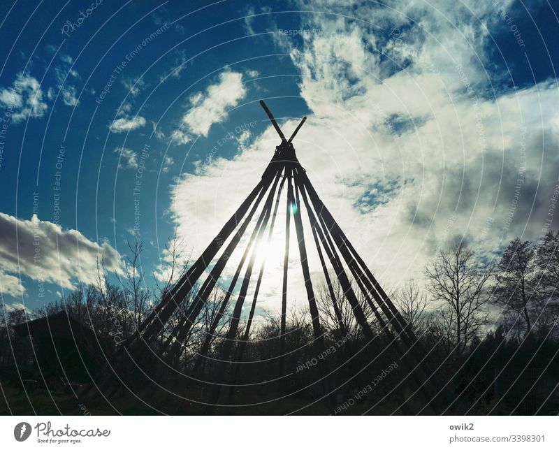 reserve Tee Pee Scaffolding Joist Tent Framework Silhouette out Sky Clouds Sun Sunlight Back-light Simple Native Americans trees