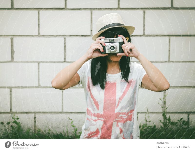 Portrait of young woman with camera photo photographer beautiful beauty european shoot selfie fun focus summer holidays expression fashion style femininity