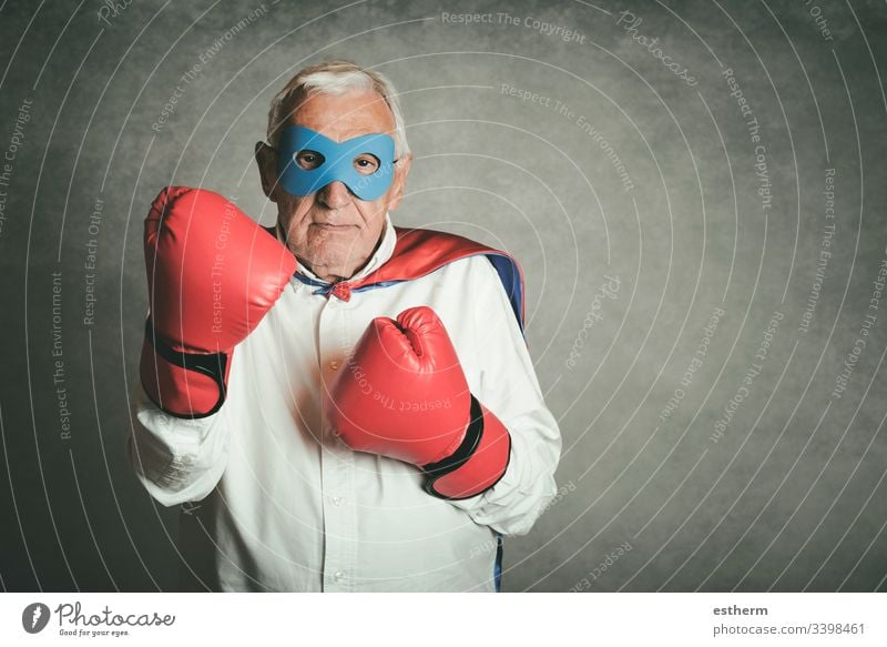 Super grandpa, senior man dressed as a superhero grandfather power victory retired pension people Senior gentleman retirement expression attitude mask disguise