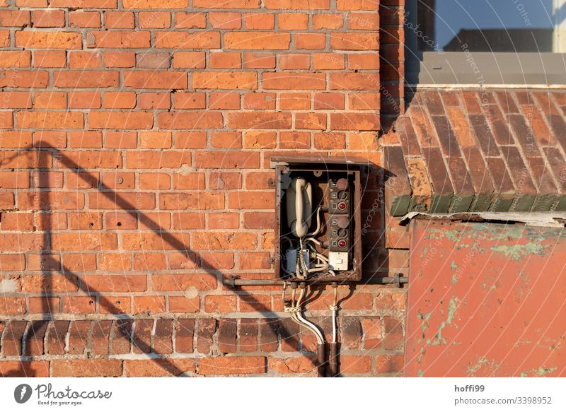 Telephone - old station to red brick wall Telecommunications Connection Receiver Cable To talk Old Retro Rotary dial Office Contact Old fashioned