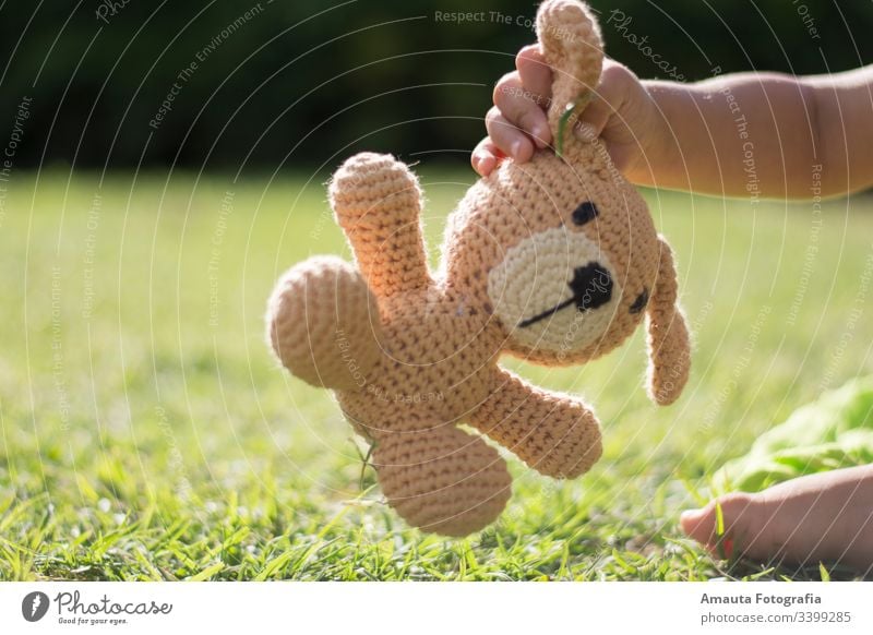 Boy holding his stuffed animal in the park friend vintage toy childhood play bear teddy home travel room sitting baby hug cute life together portrait love joy