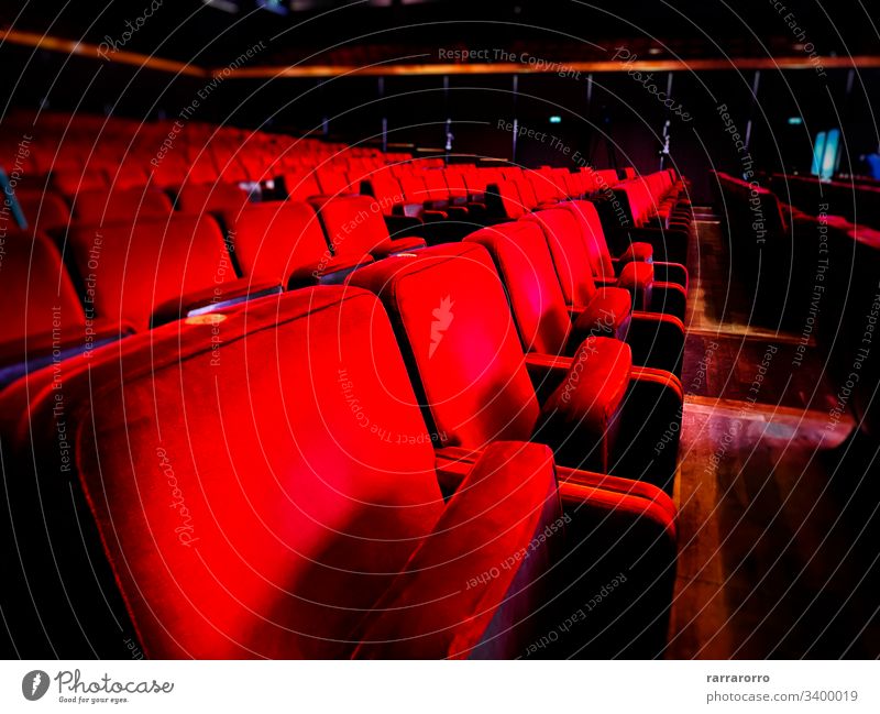 a row of empty red velvet armchairs inside an auditorium. Seat Chair Movie Theater In A Row No People Theatrical Performance Red Empty Entertainment Indoors