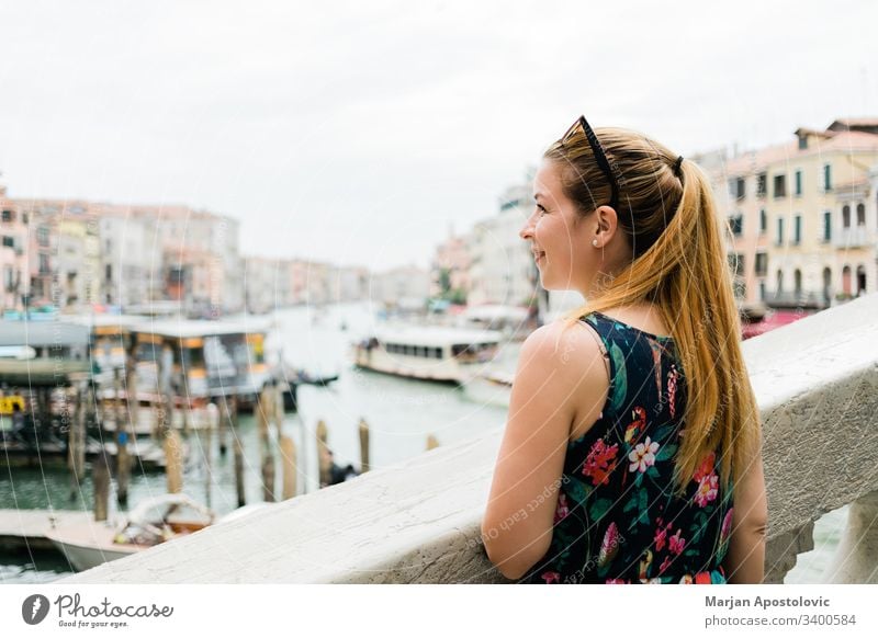 Young female traveler in Venice, Italy enjoying the view of the grand canal attraction beautiful blogger bridge caucasian chanal city cute day europe famous