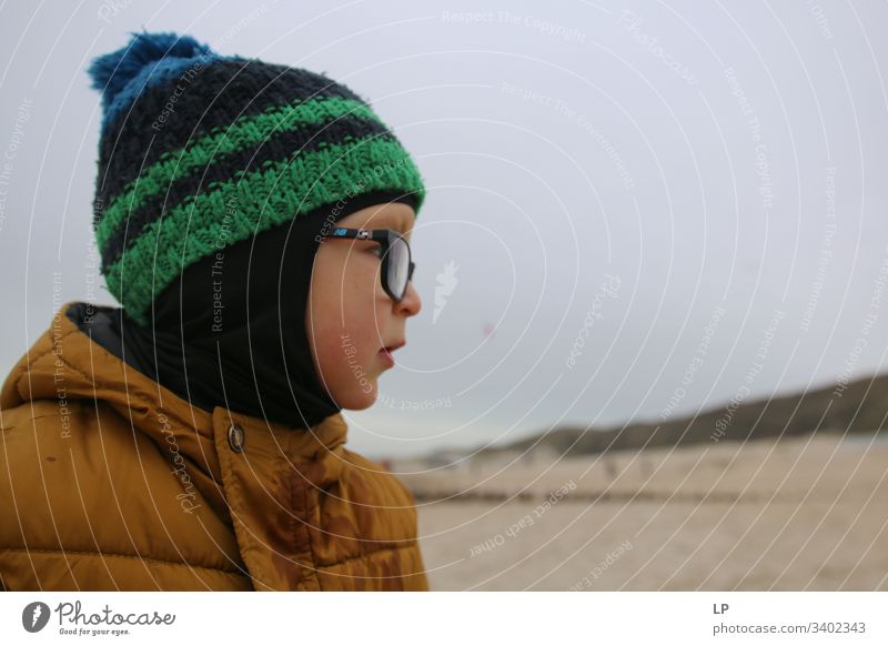 profile of a child wearing  a hat and glasses Child childhood Looking Looking away Children's game Lifestyle leadership qualities Leader future," Horizon Future