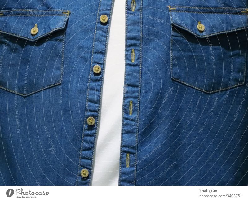 Men's chest dressed with white T-shirt and open denim shirt Clothing Upper body Fashion button facing Buttons Flap pockets Stitching Colour photo Style Textiles