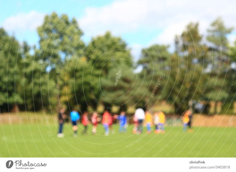 Football teams on grass pitch in break Foot ball speed Sports Blur Team gain Lose Coach coach youthful children boys Playing tournament Success Sun Summer