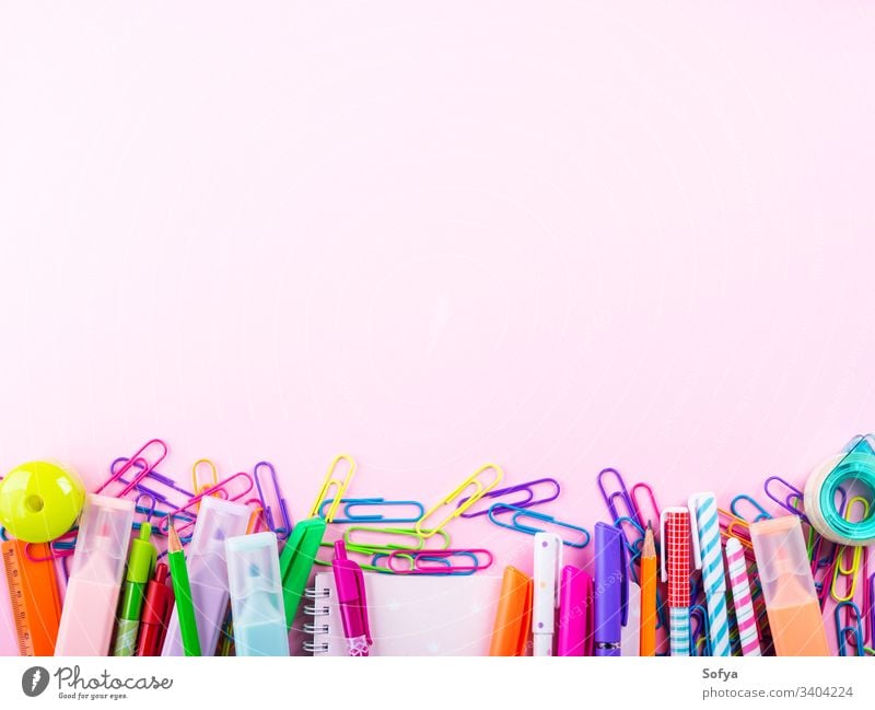 School equipment. Frame of school supplies on pink background. Flat lay.  Stock Photo