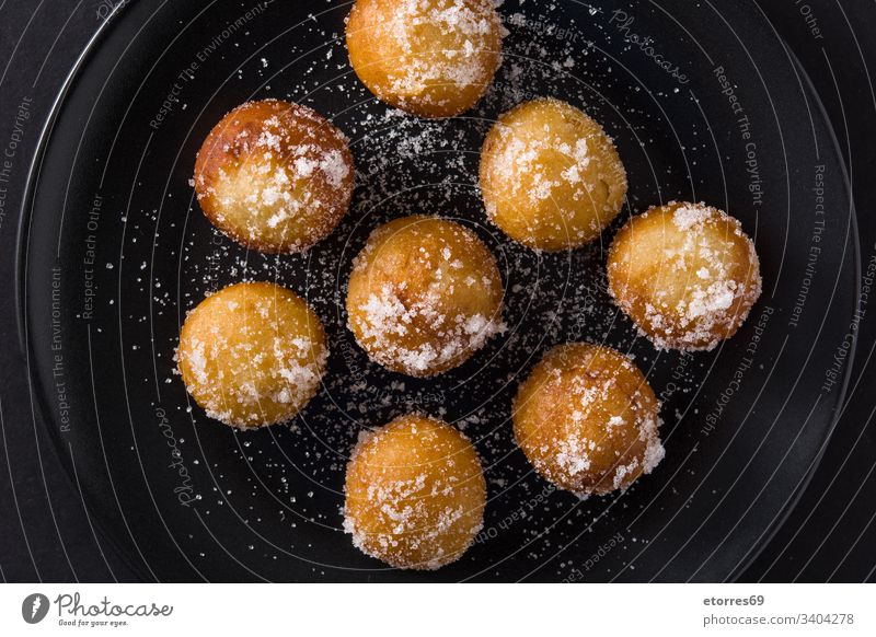 Carnival fritters or buñuelos de viento for holy week on black background top view artisan balls breakfast buns carnival christmas cooking dessert dough flour