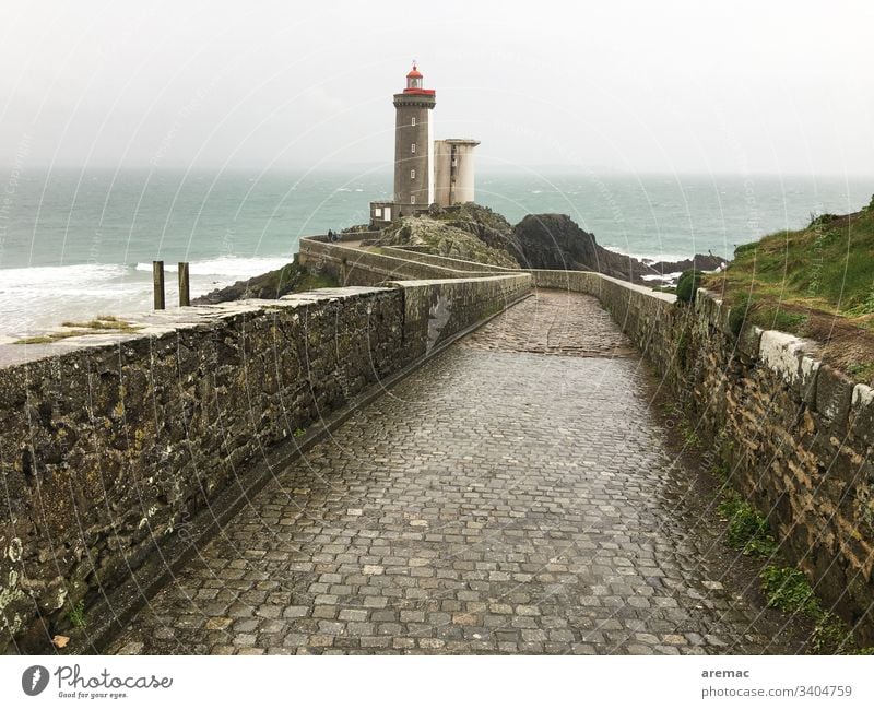 Lighthouse in the Bretagne Europe Tourism Tourist Attraction Architecture voyage Landscape Nature Paving stone Coast ocean off Lake Water