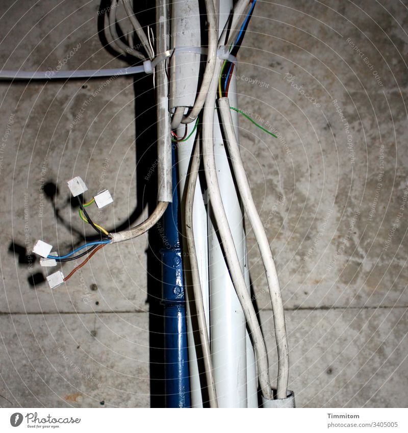 Looking for a connection! conduit tube Metal Plastic Cable Cable strap Cables electrical cables Wire connector Light and shadow Wall (building) Concrete
