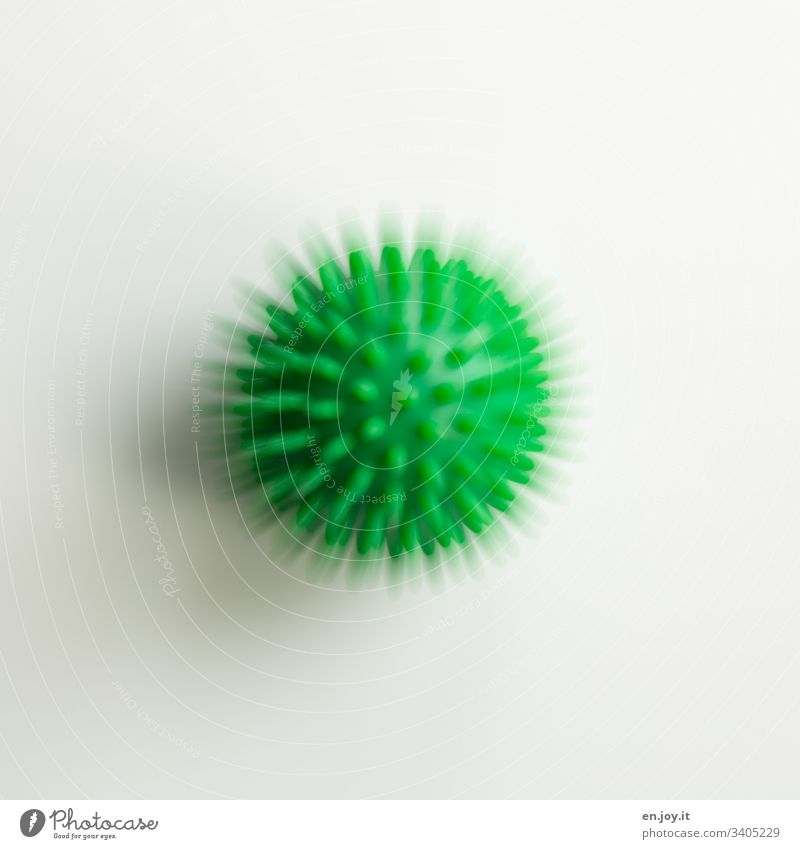 Green ball with spikes prickles Physiotherapy Therapy Illness Healthy Sports coronavirus Virus Motion blur Blur Round Hedgehog ball Ball